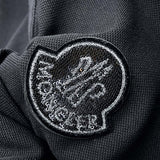 Front view of Moncler luxury clothing with logo-detail design