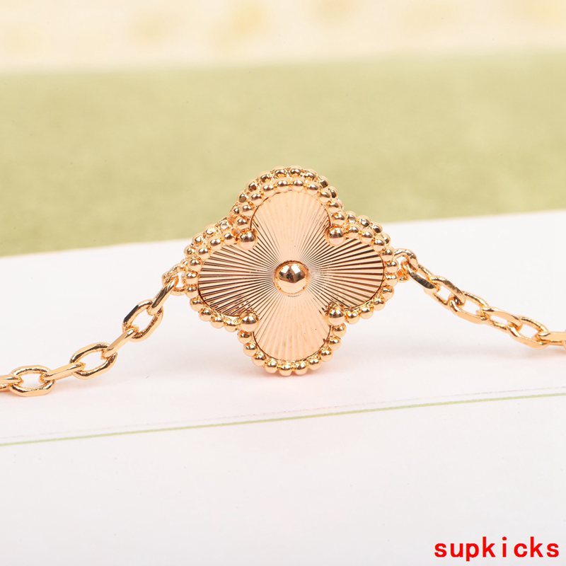 Lifestyle view of Van Cleef & Arpels unisex jewelry piece