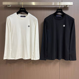 Close-up detail shot of Louis Vuitton luxury clothing with tailored silhouette