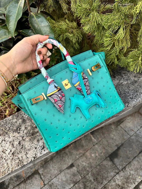 Side view of streamlined structured handbag