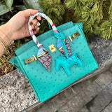 Side view of streamlined structured handbag