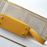 Styled lifestyle shot of signature classic women's handbag – women's statement bag