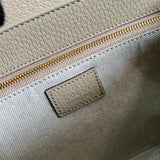 Side profile of refined premium women's handbag – women's luxury accessory
