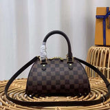 Side profile of elevated polished women's handbag – women's luxury accessory