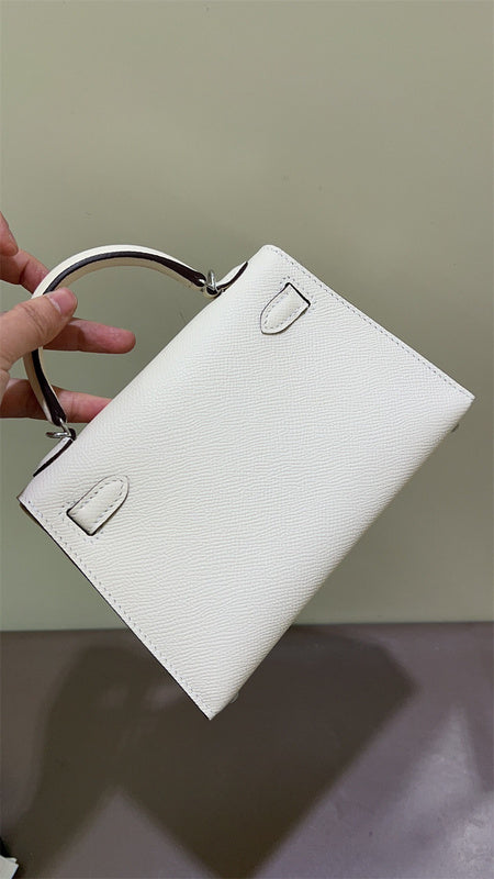 Side view of graceful structured handbag