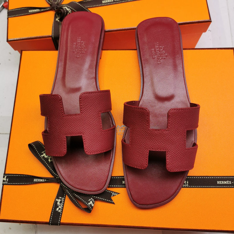 Hermès Chocolate Brown Slide Sandals - Angled View