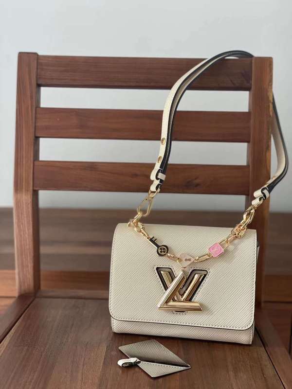 Handle and strap detail of polished statement women's handbag – women's luxury accessory