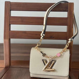 Handle and strap detail of polished statement women's handbag – women's luxury accessory