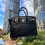 Side view of sculpted structured handbag