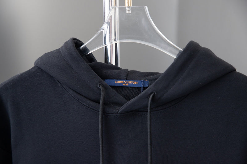 Close-up detail shot of Louis Vuitton luxury clothing with relaxed-fit cut