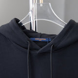 Close-up detail shot of Louis Vuitton luxury clothing with relaxed-fit cut
