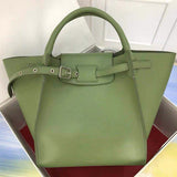 Side profile of refined modern women's handbag – women's statement bag