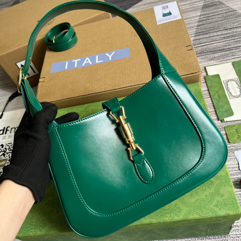Handle and strap detail of classic polished women's handbag – women's designer-style accessory