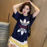 Full styled look of Gucci luxury clothing with signature branding