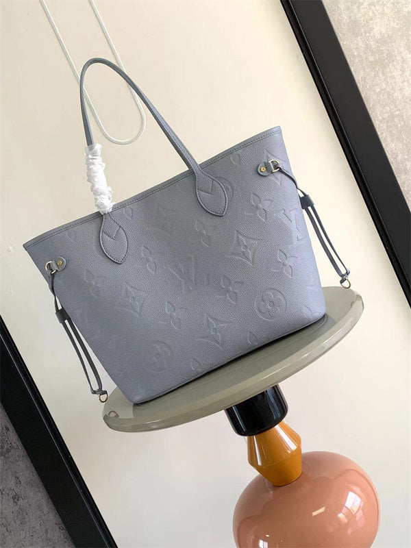  Signature tote bag carried on shoulder