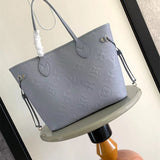  Signature tote bag carried on shoulder