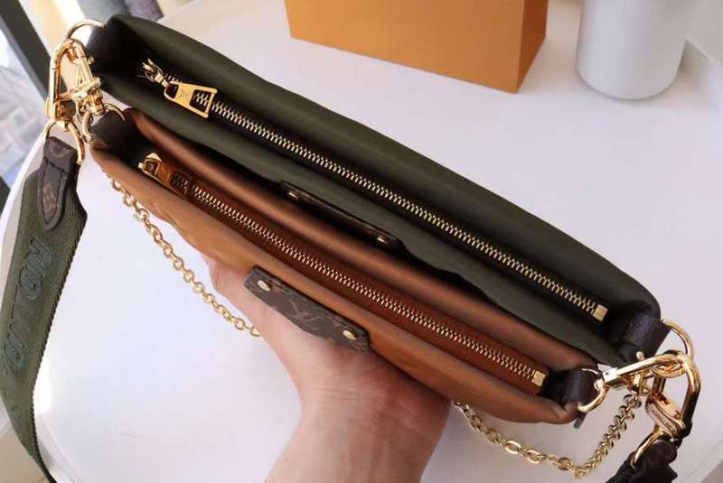 Handle and strap detail of classic sleek women's handbag – women's statement bag