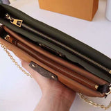 Handle and strap detail of classic sleek women's handbag – women's statement bag
