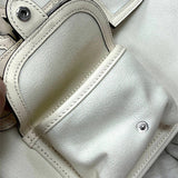Side view of fluid structured handbag