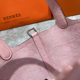 Side view of streamlined structured handbag