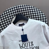 Flat lay presentation of Louis Vuitton cotton t-shirt with monogram-inspired silhouette