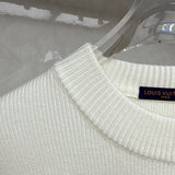Close-up detail shot of Louis Vuitton luxury clothing with relaxed-fit cut