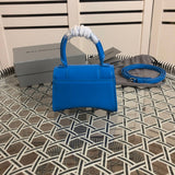Close-up detail of everyday-luxe structured women's handbag – women's statement bag