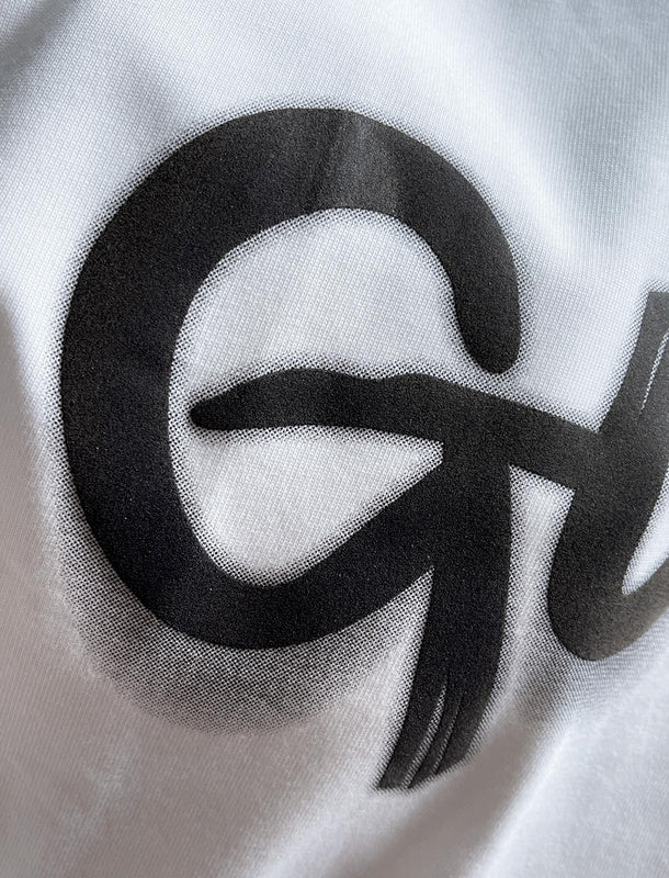 Full styled look of Gucci luxury clothing with monogram-inspired silhouette