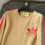 Close-up detail shot of Gucci luxury clothing with signature branding