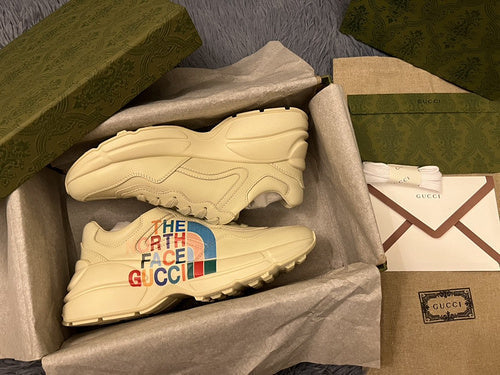 Gucci Designer sneakers in muted earth tones low-top design front view