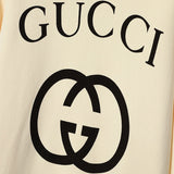 Flat lay presentation of Gucci luxury clothing with tailored silhouette