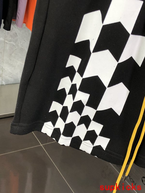 Flat lay presentation of Rhude luxury clothing with logo-detail design