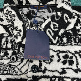 Close-up detail shot of Louis Vuitton luxury clothing with runway-inspired design