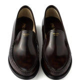 Close-up of Prada moccasins hardware and fine stitching