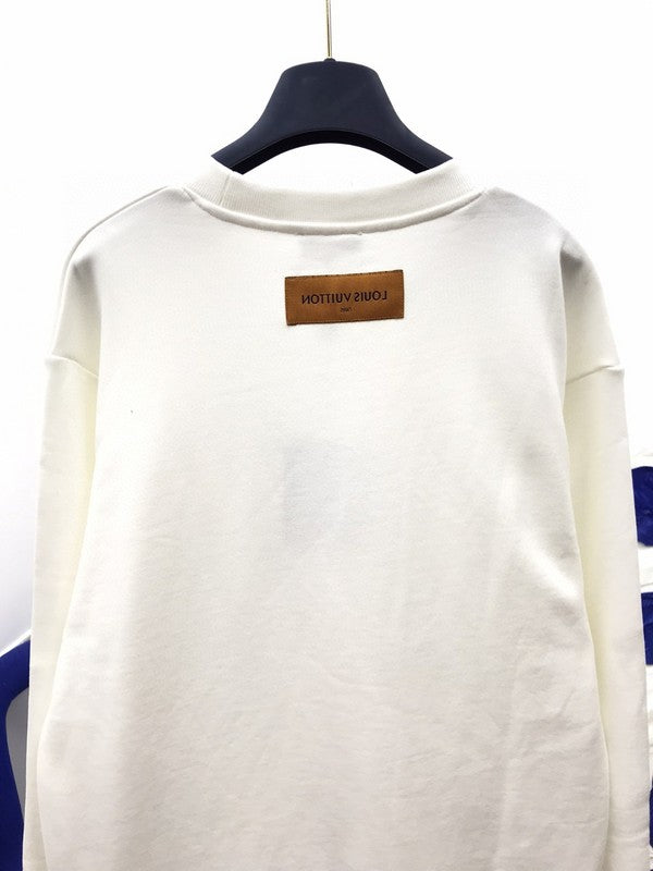 Back view of Louis Vuitton luxury clothing with label-forward styling