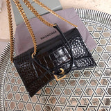 Styled lifestyle shot of structured modern women's handbag – women's luxury accessory