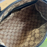 Side profile of sleek signature women's handbag – women's everyday handbag