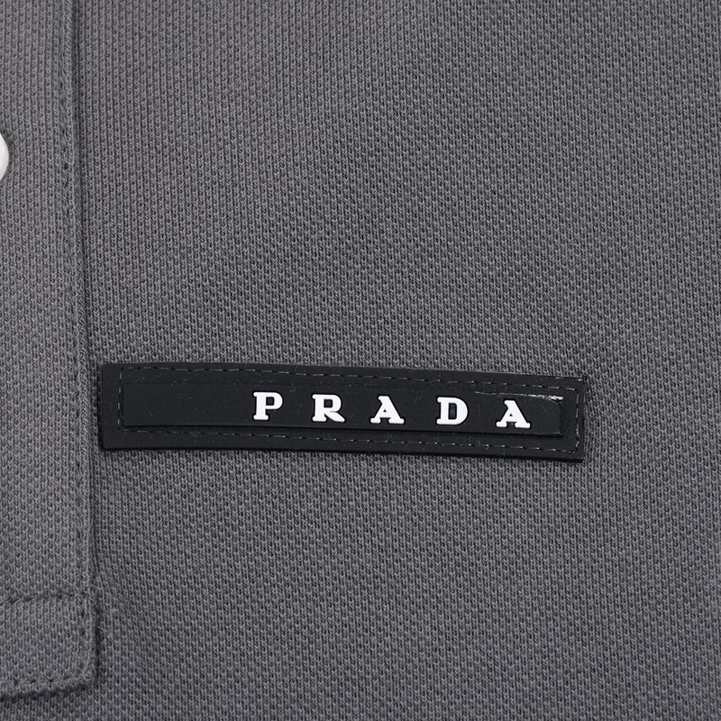 Close-up detail shot of Polo cotton polo shirt with monogram-inspired silhouette