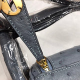 Side view of curated structured handbag