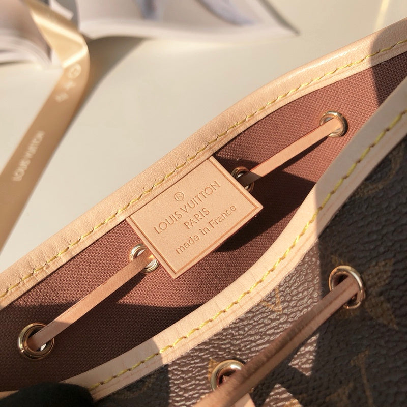 Handle and strap detail of statement polished women's handbag – women's statement bag