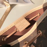 Handle and strap detail of statement polished women's handbag – women's statement bag