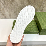 Side profile of Gucci crisp white sneakers retro runner design