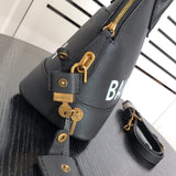Styled lifestyle shot of signature statement women's handbag – women's designer-style accessory