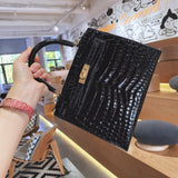 Side view of sculpted structured handbag