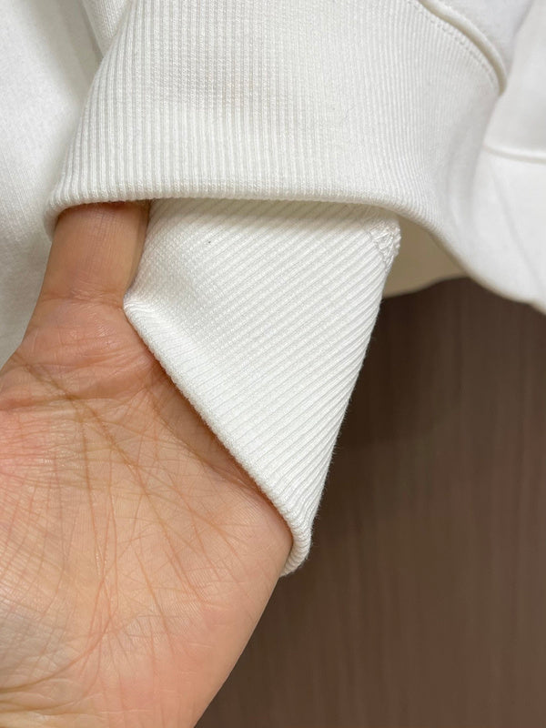 Close-up detail shot of Louis Vuitton luxury clothing with relaxed-fit cut
