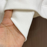 Close-up detail shot of Louis Vuitton luxury clothing with relaxed-fit cut