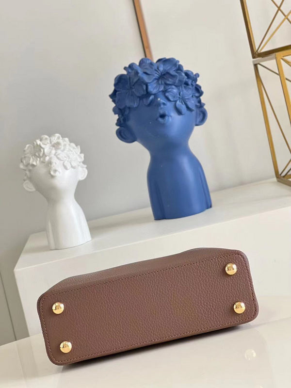 Styled lifestyle shot of structured statement women's handbag – women's everyday handbag