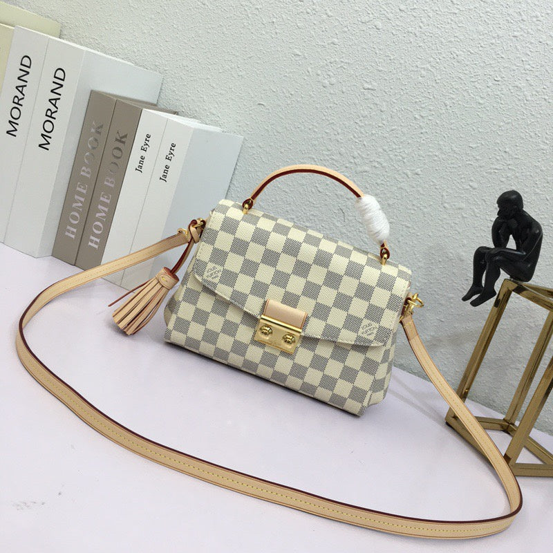 Front view of elevated modern women's handbag – women's luxury accessory
