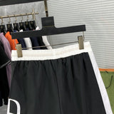 Front view of Rhude luxury clothing with label-forward styling