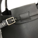 Handle and strap detail of modern statement women's handbag – women's designer-style accessory